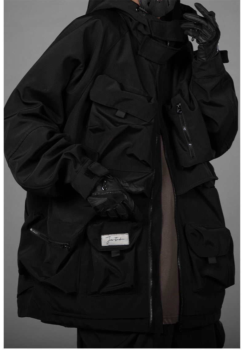 Man With Hooded Tooling And Three-dimensional Multi-pocket Jacket